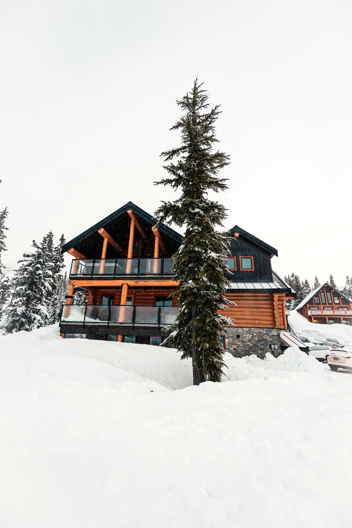 Mountain chalet lit up at dusk